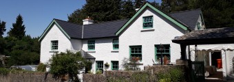 Glenveagh National Park Education Centres house sitting with green windows