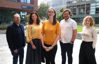 Image of 5 people standing outside 