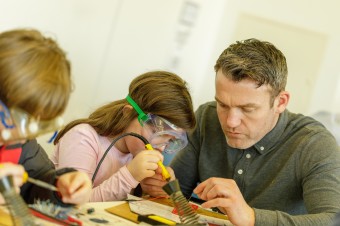 Teacher and student doing an experiment