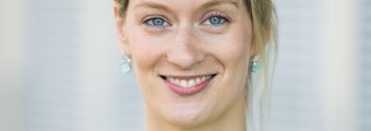 close up image of Sarah Hayes smiling wearing a green cardigan
