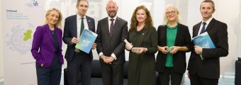 Image of 6 people standing together at the launch of the pilot programme. Some are holding copies of the SFI Climate Strategy