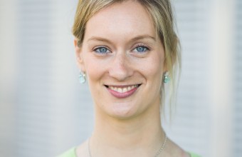 close up image of Sarah Hayes smiling wearing a green cardigan