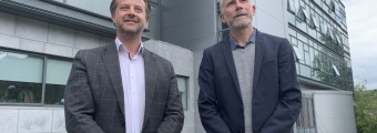 Two men dressed professional outside at University College Cork 