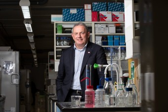 Image of Professor Ross standing in a lab