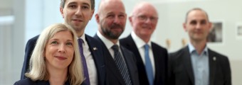 A group of 5 people dressed professional 
