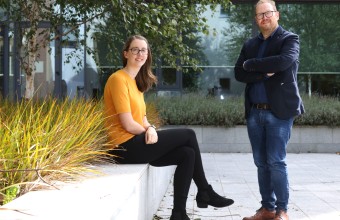 Image of Dr Jennifer Gaughran and Dr Brian Freeland outside with trees and plants in the background.