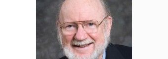 close up of Prof William C Campbell wearing a suit smiling
