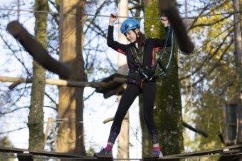 A picture of someone doing a zipline activity.