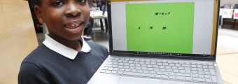 Image of a student holding a laptop