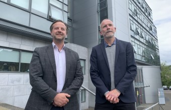 Two men dressed professional outside at University College Cork 